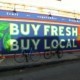 buy fresh and buy local sign promotes local businesses